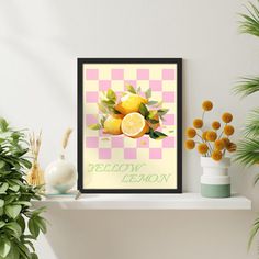 a framed lemon poster on a shelf next to potted plants