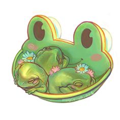 a green frog sitting in a bowl with flowers on it