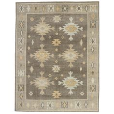 a gray and yellow rug with an intricate design on the bottom, in front of a white background