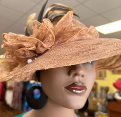 This hat is great for Many occasions . This hat can be worn for endless possibilities. The design on the front is so beautiful and impressive.This hat is pull on closure and melts on your head .Don't delay order yours today. Adjustable Fedora Fascinator For Church, Adjustable Fedora-style Fascinator For Church, Fitted Brown Hat For Summer, Fitted Brown Summer Hats, Fitted Brown Hat For Kentucky Derby, Adjustable Brown Hats For Evening, Beige Adjustable Party Hat, Fitted Beige Costume Hats And Headpieces For Party, Fitted Beige Party Hat