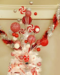 a christmas tree decorated with candy canes and ornaments