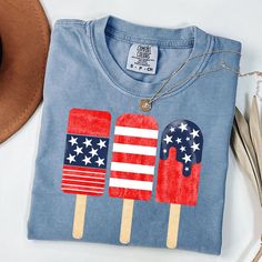 Popsicle Shirt, 4th Of July Shirt, Family Matching Shirt, Patriotic Popsicle Tee, Red Blue White Popsicle, Comfort Colors HOW TO ORDER 1. Check our photos for color and sizing options.  2. Choose your quantity. 3. Select your size and color from the drop-down menus. 4. Click "ADD TO CART" to add the shirt to your virtual cart.  5. Click "PROCEED TO CHECKOUT" to purchase your shirt.  6. Your shirt is now off to production! We will process your order and your shirt will be ready to ship in 1-3 day Blue American Flag Top For 4th Of July, Blue Graphic Print Shirt For Memorial Day, Blue Shirt With Flag Print For Independence Day, American Style Blue Tops For Independence Day, Red American Style Tops For Memorial Day, American Style Red Tops For Memorial Day, American Style Red Top For Memorial Day, Blue Cotton Shirt For Memorial Day, Casual Blue Shirt For Independence Day