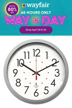 a white clock with the words way and day on it's front side, next to an advertisement for a hair salon