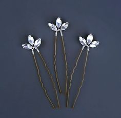 A set of 3 pretty crystal hair pins, handmade using sparkling navette rhinestones, silver plated wire and hair pins.  Perfect for weddings or just for that something pretty! If you have any questions please get in touch! Hair Jewelry Wedding Brides & Hairpins, Crystal Hair Clip, Bride Hair Jewelry Brides & Hairpins, Gemstone Hair Pin, Crystal Bridemaid Hair Clip, Gold Leaf Headband, Gold Hair Accessories Wedding, Bridesmaid Hair Clips, Hair Accessories Vintage