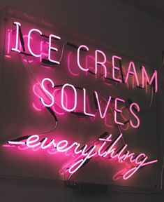 a neon sign with the words ice cream solves everything in pink and white letters