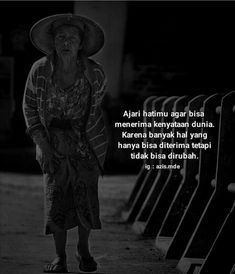 an old woman wearing a hat standing in front of some chairs with a quote on it