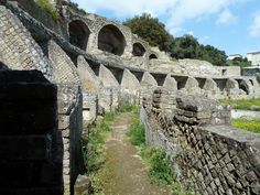 an ancient roman city with stone walls and arches