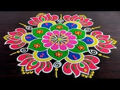 a colorful flower design on a wooden table