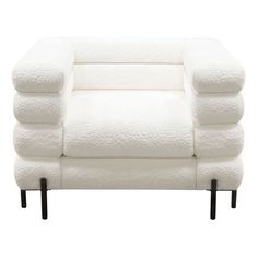 a white couch sitting on top of a wooden frame