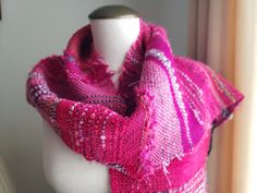 "Beautiful art scarf will make any coat or outfit sparkle. Unique! It is woven in the Saori style, which is a Japanese freestyle handwoven. This scarf was woven with a variety of gorgeous fibers: cotton, wool, novelty yarns in a delightful color combination (magenta-cyclamen-fuchsia, pink, greys, black). It will look great with a winter coat or it will add a splash of excitement to any outfit. The scarf measures  72\" long and 10\" wide which includes fringes (183x25cm) or 66\"x10\"(168x25cm) wi One Size Pink Shawl For Winter, Pink One Size Shawl For Winter, Pink Scarves As Gifts, Pink One-size Winter Shawl, Pink Bohemian Scarf For Fall, Pink Hand Knitted Scarves One Size, Pink Bohemian Scarves For Fall, Handmade Pink Shawl As Gift, Pink Shawl Scarves For Fall