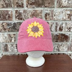 Authentic Pigment Cotton Cap In A Muted Red With Hand Painted Sunflower. 100% Cotton, 6 Panel, Sewn Eyelets, Self Fabric Closure D-Ring Slider And Tuck In Strap. One Size. Hat Band 22.8”. New. Washable. Each Item Is Individually Hand Painted By Me. Yellow Flower Hat For Spring, Yellow Flower-shaped Hats For Spring, Yellow Cotton Sun Hat, One Size Fits Most, Yellow Cotton Sun Hat, Yellow Cotton Hat (one Size Fits Most), Casual Red Cap Sun Hat, Red Cap-shaped Sun Hat, Red Cotton Sun Hat For Spring, Casual Red Sun Hat One Size