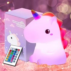 the unicorn remote control is next to an electronic box that says unicorn chocolate night light