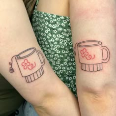 two people with matching tattoos on their arms, one has a coffee mug and the other has a toaster