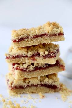 three cookies stacked on top of each other with crumbs scattered around the edges