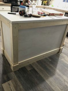 a kitchen island made out of plywood boards