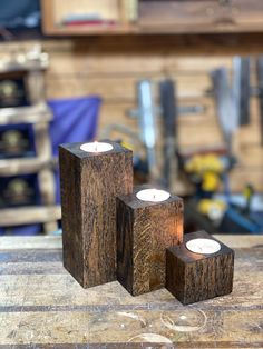 two wooden candles are sitting on a table