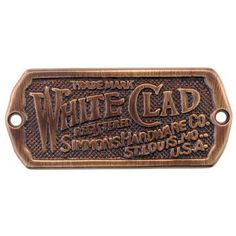 a metal sign that says white cadd