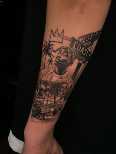 a man's arm with a black and white photo on it that says best coast