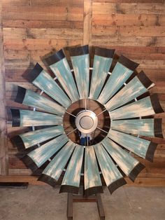 the windmill ceiling fan is on display in front of a wooden wall with an instagramtion