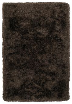 an area rug with dark colored fur on it