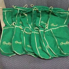 several green bags sitting on top of a chair