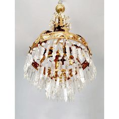 a gold chandelier hanging from the ceiling