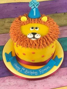 a birthday cake with a lion face on top