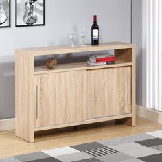 a wooden cabinet with two wine glasses on top