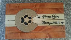 a wooden sign that says franklin and benigann with hearts on the front side