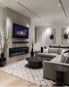 a living room with a large couch and fireplace