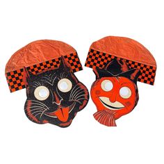 two masks that have faces on them