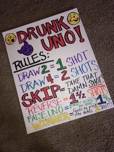 a poster on the floor that says drunk uno rules = 1 shot draw 4 shots skip 3 times