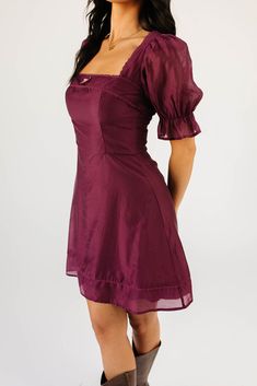 both moody + enchanting, this zoco exclusive puff sleeve mini dress was made for cocktail parties, fancy dinner dates, + anything that calls for a hint of sophistication. with its sleek cinch waist silhouette + dainty bow detail, it’s a timeless classic you’ll be wearing again + again, season after season. plum // mini length, square neckline, puff sleeves, elastic cuffs, bow detail, lace trim detailing, back tie, smocked back, back zipper closure, lined model is 5'8" + wearing a small measureme Flirty Mini Length Puff Sleeve Dress For Night Out, Purple Fitted Mini Dress With Puff Sleeves, Purple Short Sleeve Mini Dress For Night Out, Flirty Puff Sleeve Mini Dress For Cocktail, Mini Dress With Gathered Sleeves For Date Night, Purple Chic Mini Dress With Square Neck, Chic Purple Mini Dress With Square Neck, Chic Purple Square Neck Mini Dress, Flirty Mini Dress With Gathered Sleeves For Date Night