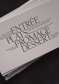 four white business cards stacked on top of each other with the words entree plates fromage dessert