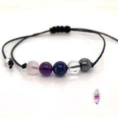 A great rejuvenation tool if you or someone you know needs extra healing energy around them! This 6mm crystal healing bracelet has a lovely combination of pink rose quartz, deep purple amethyst, rich deep blue lapis lazuli, clear quartz, and deep grey genuine non-magnetic hematite.  These 5 gems in this comfy beaded bracelet are perfect crystals for anyone who is recovering or who needs crystal energy. This genuine gemstone bracelet features 5 dainty 6mm beads in the center for a light dainty mi Adjustable Black Crystal Bracelet, Spiritual Hand-strung Crystal Bracelet For Healing, Adjustable Nickel-free Crystal Bracelet For Healing, Elegant Hand-strung Crystal Bracelet For Meditation, Adjustable Rose Quartz Bracelets - Spiritual Style, Hematite Bracelet, Energy Bracelets, Rose Quartz Bracelet, Healing Crystal Jewelry