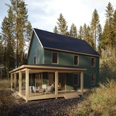 a large green house with a covered porch