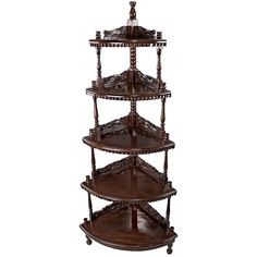 three tiered wooden shelf with ornate carvings