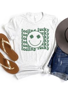 Get ready to spread some joy and good vibes with our Feeling Lucky Women's Jersey Short Sleeve T-Shirt. Featuring the words "Feeling Lucky" written in a retro font with a big smiley face with shamrock eyes in the center, this t-shirt is the perfect way to celebrate St. Patrick's Day or just show off your positive attitude. Made from soft, breathable fabric, this t-shirt will keep you comfortable all day long. With 12 fun colors to choose from and 6 sizes, you're sure to find the perfect fit. Whe Big Smiley Face, Magical Thinking, Shamrock Shirt, Feeling Lucky, Womens Jersey, Retro Font, Pink M, Smile Face, Positive Attitude