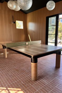 a ping pong table in an empty room