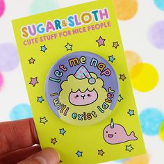 someone is holding up a badge that says sugar & sloth cute stuff for nice people