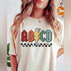 Abcd Ac/Dc Shirt. Brand New! Perfect For All Teachers And Instructors And Professors. Substitute Teacher Clothes, Simple Teacher Shirts, Teacher Design Shirts, Teacher Shirt Cricut, Sporty Teacher Outfits, Teacher Graphic Tees, Substitute Teacher Shirts, Daycare Worker Outfits, Casual Teacher Outfits Summer