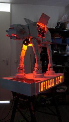 a lego star wars at - at standing on top of a table with the words imperial air written below it