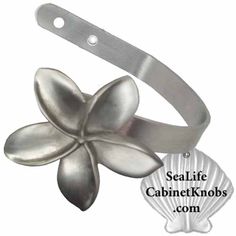 a metal flower on a white background with the words seal life cabinet knobs com