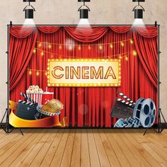 an image of a red curtain with some movies on it and popcorn buckets next to it