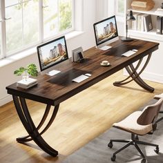 a computer desk with two monitors on it