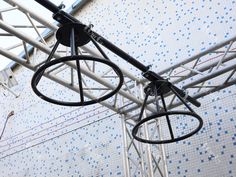 an overhead view of a metal structure with blue and white tiles on the wall behind it