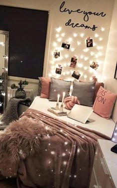 a bedroom with lights on the wall and a bed