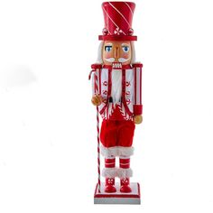 a red and white nutcracker ornament on a white background