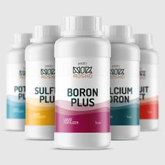 four bottles of boron plus with different colors on the top and bottom, in front of