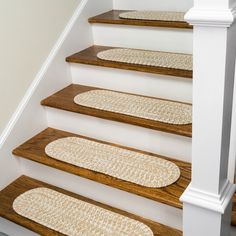 a set of stairs with rugs on them